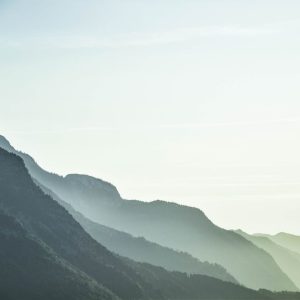 Mountain Landscapes - A serene view of misty mountain layers in Schwaz #1054222
