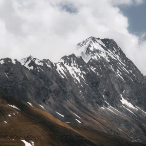 Snow Mountains - Soaring snow-capped peaks against cloudy skies i #12940688