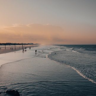 Beach Scenery - A peaceful sunset at a sandy beach with gentle w #12951940