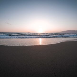 Beach Scenery - Beautiful sunset over a tranquil beach with gent #13335454