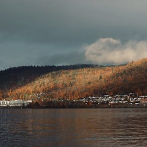 Lake Reflections - A scenic view of Jönköping's hillside with autum #19068033