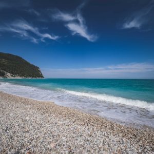 Beach Scenery - Peaceful pebble beach and turquoise ocean agains #19498660