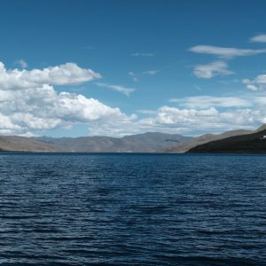 Lake Reflections - Tranquil mountain lake under a bright blue sky,  #20499743