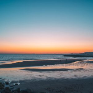 Beach Scenery - Calm ocean waves and a sandy beach under a color #22422130
