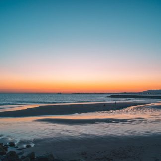 Beach Scenery - Calm ocean waves and a sandy beach under a color #22422130