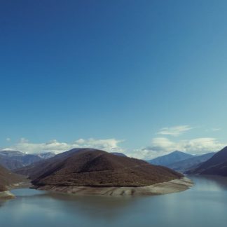 Lake Reflections - Peaceful landscape of Ananuri reservoir and moun #31895783