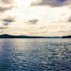 Lake Reflections - Peaceful Lake Windermere scene with calm waters  #33595557