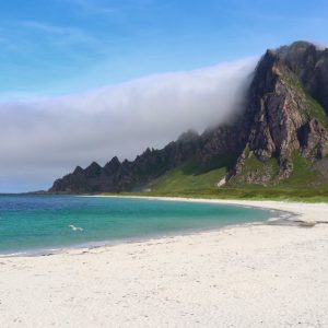 Beach Scenery - Explore the tranquil beach with towering mountai #34146948