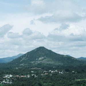 Mountain Landscapes - Lush green hills under a cloudy sky in Bengaluru #34271583