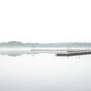 Lake Reflections - A tranquil misty lake scene with a wooden dock e #35081742