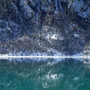 Lake Reflections - Serene winter landscape with snow-laden mountain #35352506