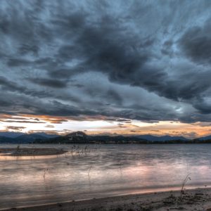 Lake Reflections - Captivating view of a dramatic cloudy sunset ove #35642520
