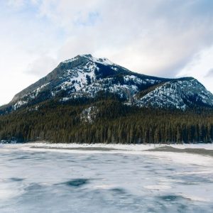 Lake Reflections - Stunning view of a snow-capped mountain and froz #36259794