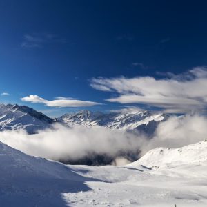 Snow Mountains - Snow-covered peaks and dramatic clouds create a  #36524761
