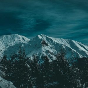 Snow Mountains - Serene snow-covered peaks with dark sky creating #3684925