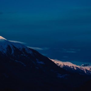 Snow Mountains - Snow-capped mountains under a twilight sky, offe #6407611